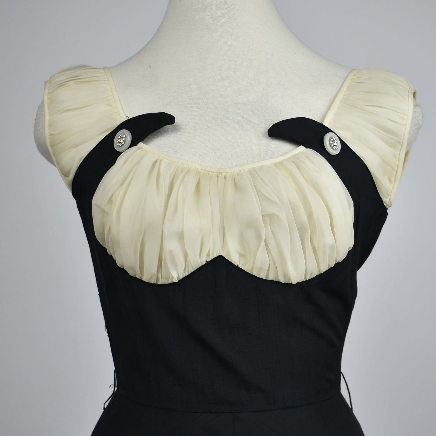 Vintage 1950s Black and White A-Line Dress with Underbust Corset Shape, Ruching Details, and Bedazzled Accent Buttons